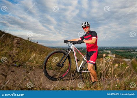 Male Mountain Biker Resting Near His Bike Stock Photo Image Of