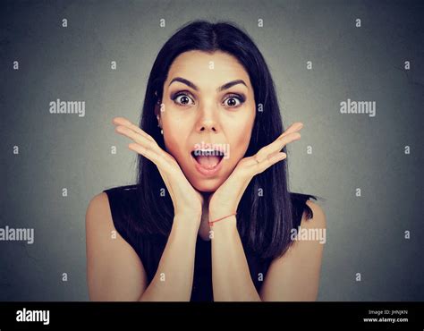 Surprised Young Woman Shouting Over Gray Background Stock Photo Alamy
