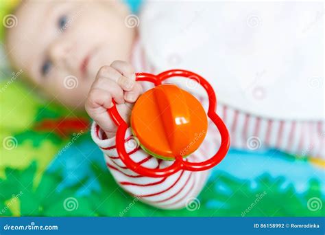 Cute Baby Girl Playing With Colorful Rattle Toy Stock Photo Image Of
