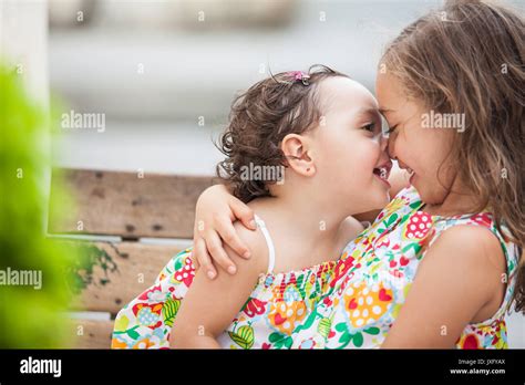 Two Young Sisters Kissing Hi Res Stock Photography And Images Alamy