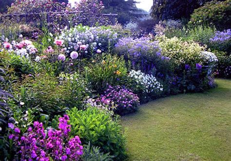 On a very sunny day in june in south germany you see details and colors of cottage country. Beautiful English Flower Garden - DECOREDO