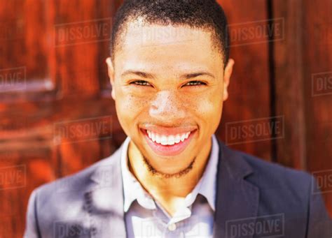 Black Businessman Smiling Outdoors Stock Photo Dissolve