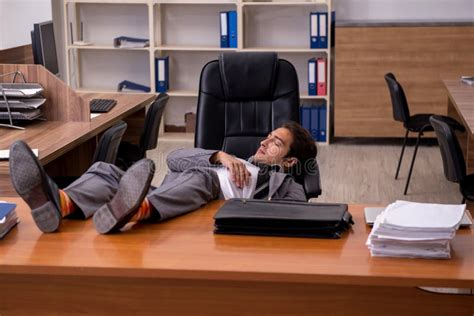 Young Male Employee Sleeping At Workplace Stock Image Image Of