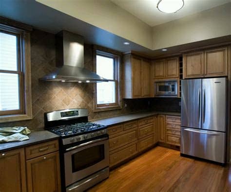 The dark wood finish looks chic and inviting, and the. New home designs latest.: Ultra modern kitchen designs ideas.
