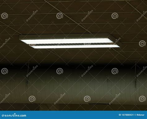 Row Of Fluorescent Lights In An Office Building Ceiling And Lighting