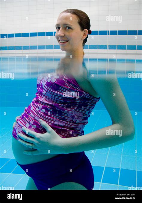 Pregnant Woman Swim Swimming Swims In A Swimming Pool Uk Stock