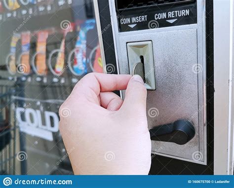 Paying With A Quarter Coin In A Vending Machine Stock Photo Image Of