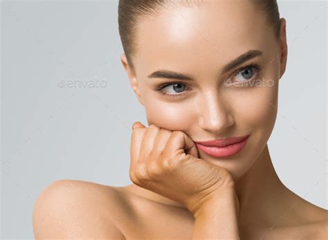 Clean Skin Woman Face Close Up Skin Beauty Tanned Face Beautiful Smile Over Blue Background