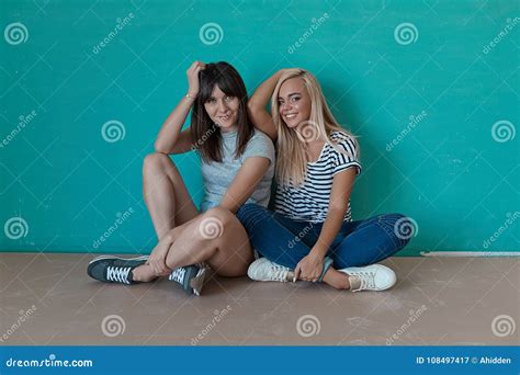 Two Cheerful Girls Enjoy Each Others Company Stock Image Image Of Clothes Joyful 108497417