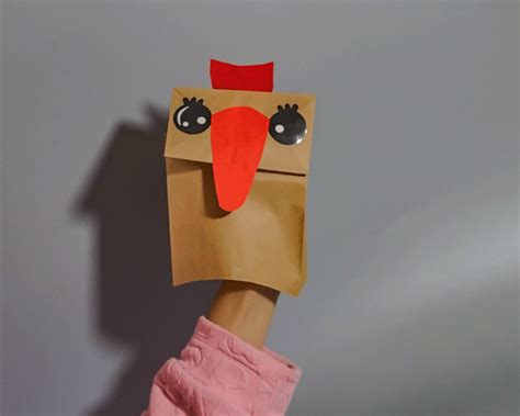 二年级用纸袋做小鸟创意手工玩具图解 有趣的手偶公仔折纸图片💛巧艺网