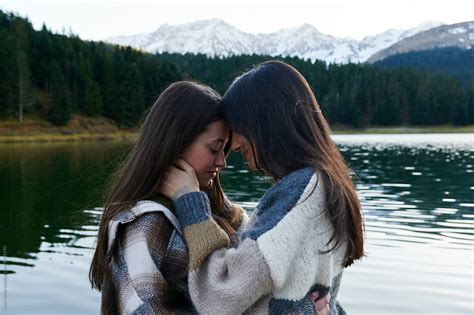 Young Lesbian Couple Sharing A Moment On A Dock By Stocksy Contributor Ivan Gener Stocksy