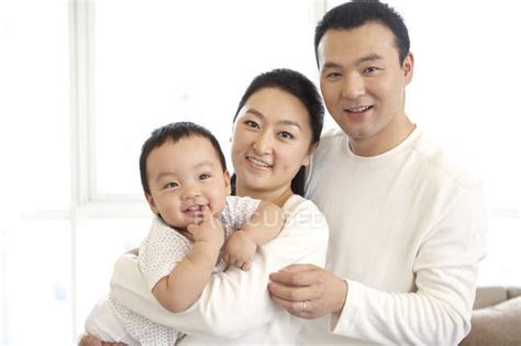 Chinese Parents Holding Baby Son — Mother Selective Focus Stock