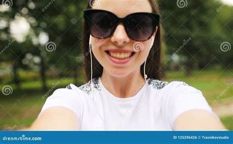 Young Girl Making Video Selfie And Having Fun In The Park Lifestyle Selfie Portrait Of Young