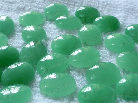 Wholesale polished raw semi precious stone natural green strawberry quartz crystal palm stone for healing. 10x14mm dyed green jade oval cabochon 染色玉 « Bling gems Co ...