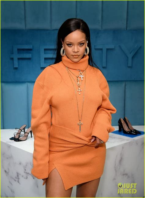 rihanna stuns in all orange for bergdorf goodman digital window unveiling photo 4431946