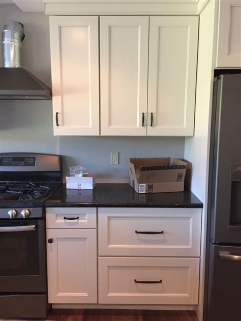 New 24 x kitchen cupboard cup drawer furniture shell pull iron handle +screws. Upper cabinet pulls hung too high - change or leave as is?