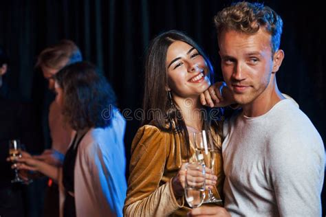 Portrait Of Lovely Couple Have Party Together With Their Friends Stock
