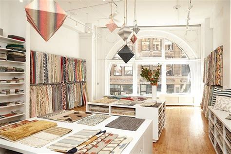 A Room Filled With Lots Of Different Types Of Fabrics And Rugs On