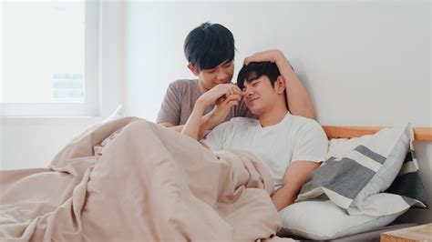 Free Photo Handsome Asian Gay Couple Talking On Bed At Home Young