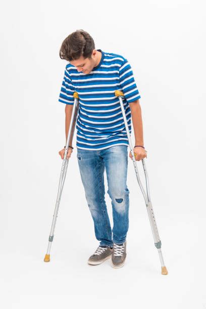 Man On Crutches Isolated Stock Photos Pictures And Royalty Free Images