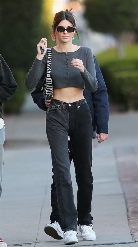 Kylie jenner tucked sweatpants into clear plastic booties and people have ~feelings~ about it. Kendall Jenner donning a Grey woolen crop top with a ...