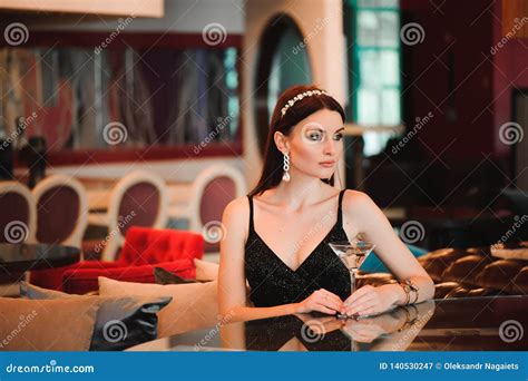 Portrait Of Beautiful Woman Holding Glass Of Martini Stock Image