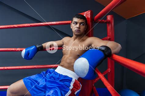 Male Boxer Sitting In The Corner Of The Boxing Ring Royalty Free Stock