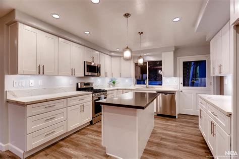 Ice white shaker cabinets will add a cool splash of style to any kitchen. Bright Kitchen w/ White Shaker Cabinets - NKBA