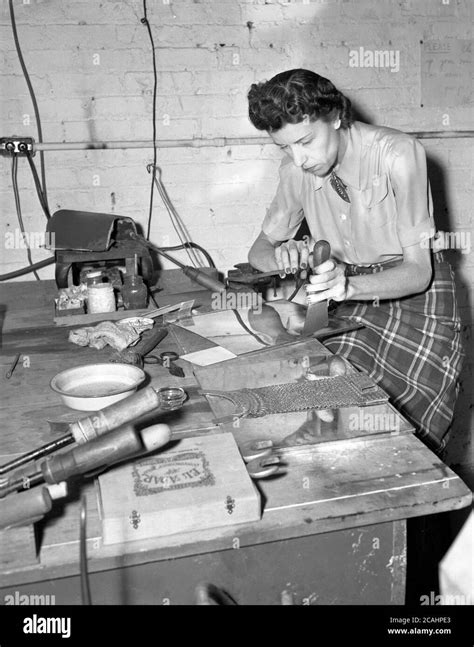 Circa 1940s Historical A Lady In A Small Craft Workshop Sitting At A
