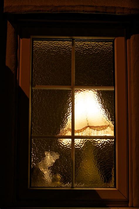 An Old Fashioned Lampshade And The Rippled Glass Lovely Picture Through A Nighttime Window