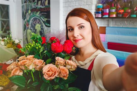 Young Girl Working In A Flower Shop Florist Woman Makes A Bouquet
