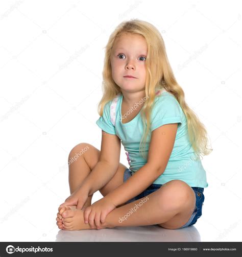 Little Girl Is Sitting On The Floor Stock Photo By ©lotosfoto1 186919860