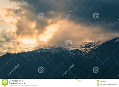Moody Clouds At Sunset Above Rocky Mountains Stock Photo Image Of