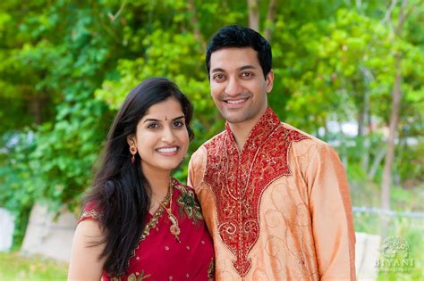 Indian Couple Posing For Their Engagement Photos At The Gardens Out The
