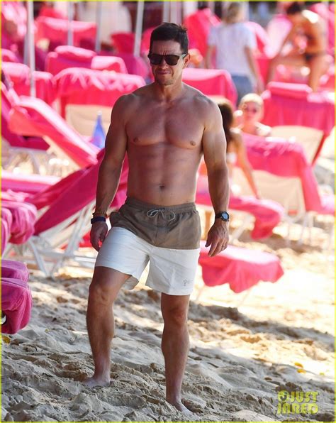 mark wahlberg continues to showcase his impressive swimsuit collection during barbados vacation