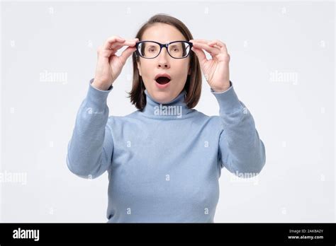 Funny Surprised Woman Looking Through Glasses Looking At Camera Open