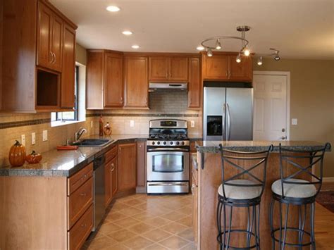 Refacing your cabinets means covering the existing cabinet boxes with a thin veneer (which could be vinyl or real wood) and completely replacing the doors and drawer so what might you expect to pay for refacing your cabinetry? Refinishing Kitchen Cabinets to Give New Look in the ...