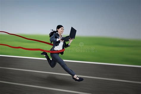 Executive Businesswoman Running And Holding Laptop Stock Image Image