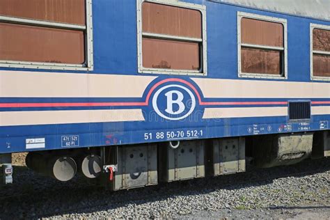 view on ancient historical train wagon on sidetrack with logo lettering of belgian national