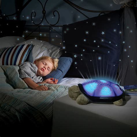 From within his plastic shell, twilight turtle projects a complete starry night sky onto the walls and ceiling of any room. Stuffed animal lights up ceiling - ultimate level of ...