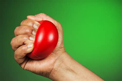Hand Squeezing Red Stress Ball Photograph By Vishwanath Bhat Pixels