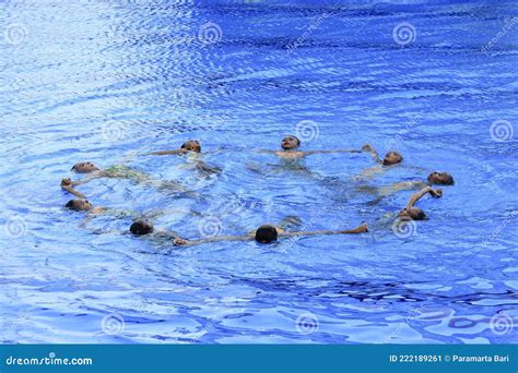 Five Swimmers Racing Against Each Other In A Swiming Pool Editorial