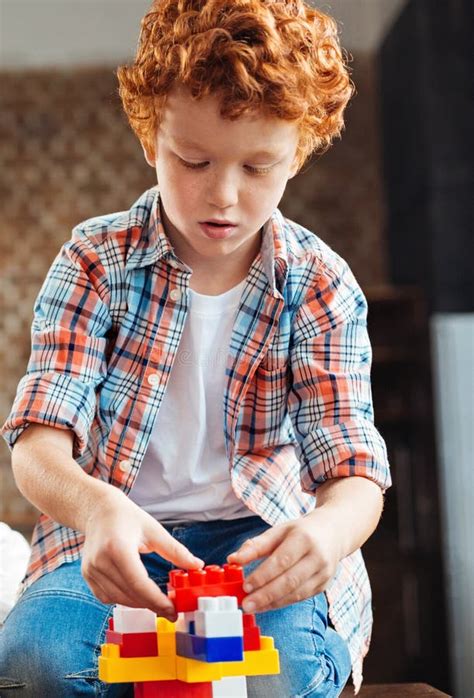 Concentrated Little Boy Playing With Building Blocks Stock Image
