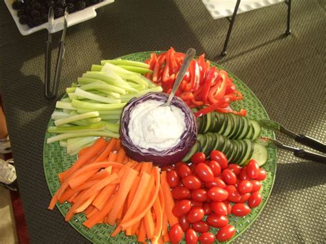 Layers of cheesy ravioli and tomatoes make this recipe hearty and delicious. Finger food party ideas. Dig the purple cabbage dip ...