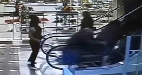 Video Shows A Woman Straddling An Escalator Rail And Being Pulled