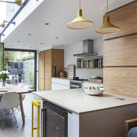 The dark, moody tile walls, sleek backsplash, and stainless steel danielle colding used a glass backsplash for a shinier, more modern and cosmopolitan touch in this city apartment. Open-plan kitchen design ideas | Open-plan kitchen ideas ...