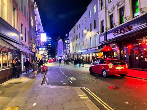 People Walking On Soho London Street At Night Editorial Stock Photo