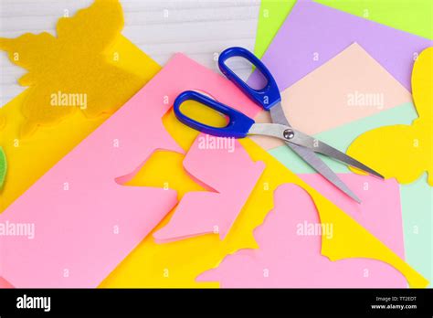 Women Hand Cutting Colorful Paper With Scissors Stock