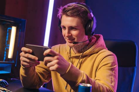 Handsome Pro Gamer Playing Mobile Video Games On Online Esport
