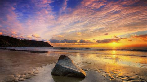 Ocean And Rock During Lovely Sunset Evening Under Cloudy Sky Hd Sunset